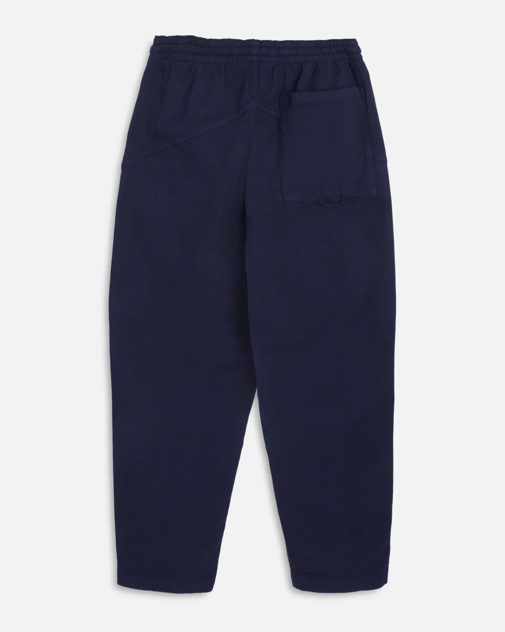 A pair of navy blue You Must Create Alva Skate trousers with an elastic waistband and drawstring, shown flat against a light grey background.