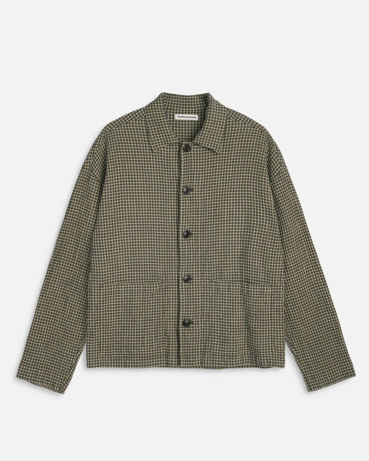 A long-sleeve button-front jacket with a small-scale houndstooth pattern in olive green and black, displayed flat against a light gray background.