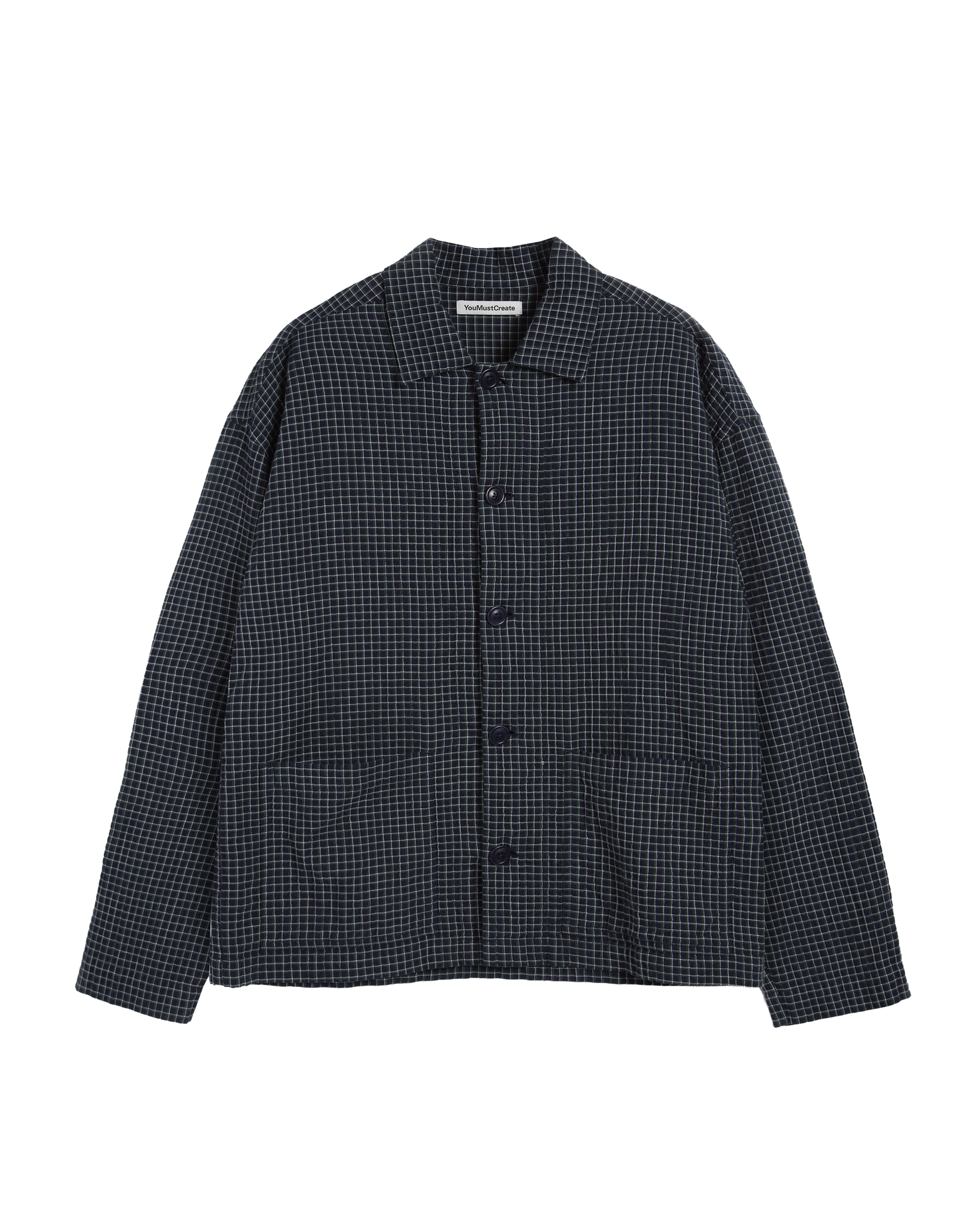 Navy, green and white checkered shirt on a white background