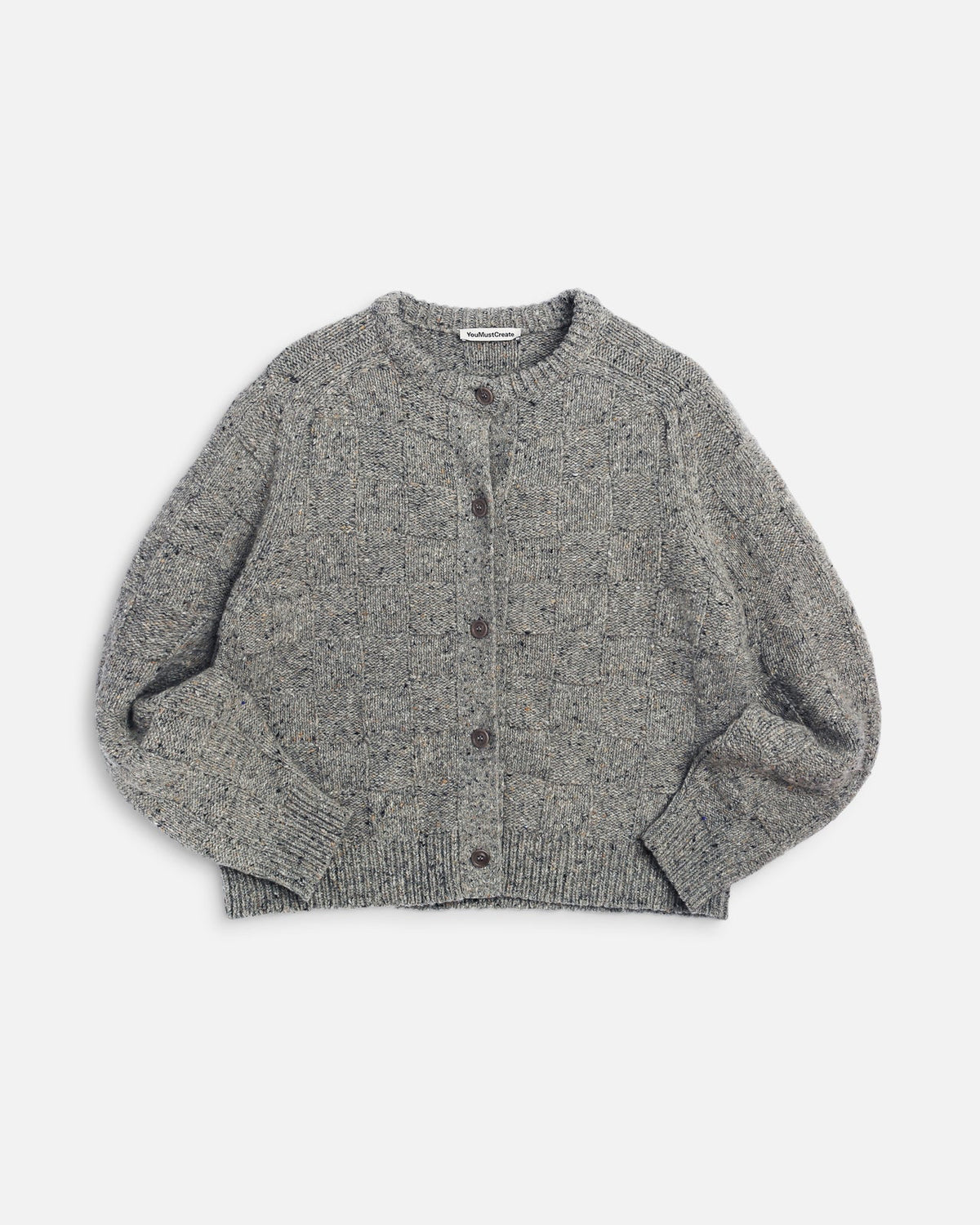 You Must Create Grey atomic cardigan against a light grey background 