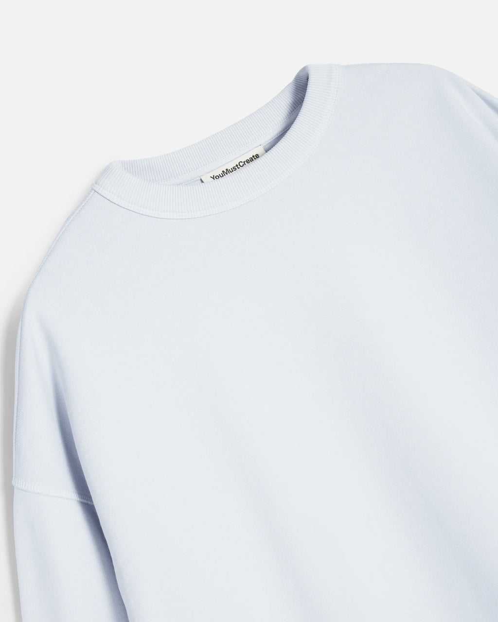 Light blue/grey sweatshirt with a brand logo on a white background