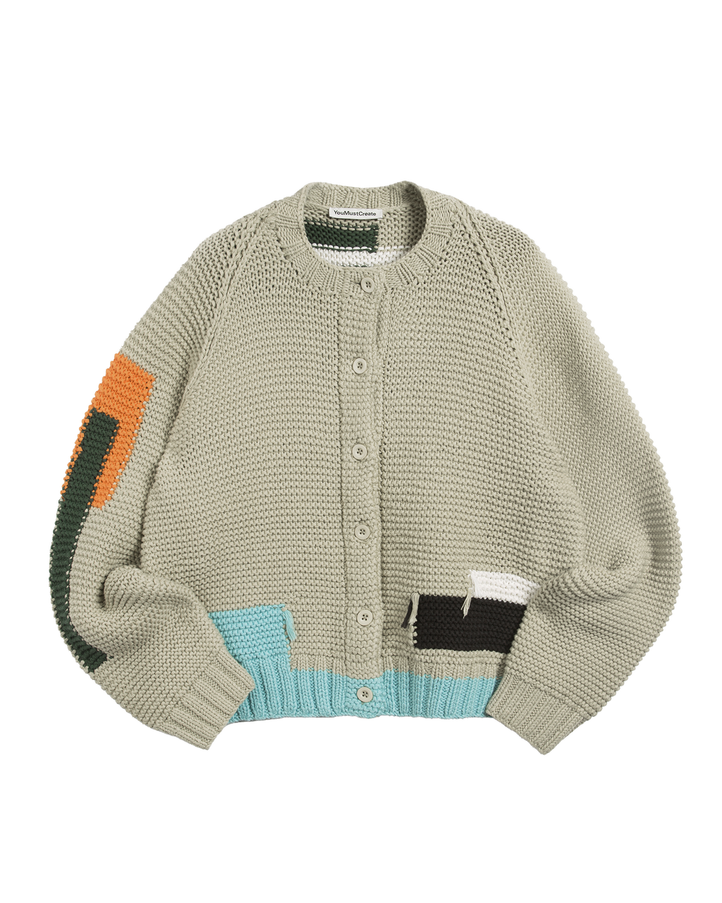 Knitted cardigan with color-blocked sleeves on a white background