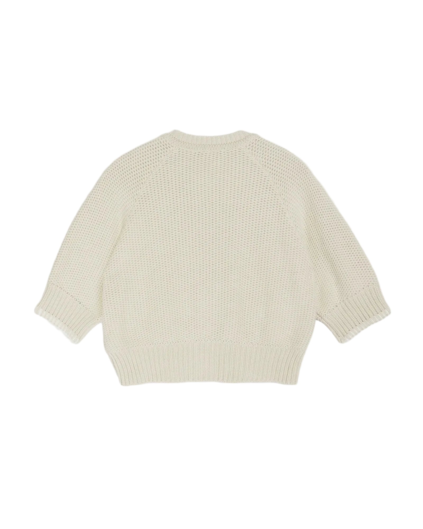 Light yellow knitted sweater on a white background