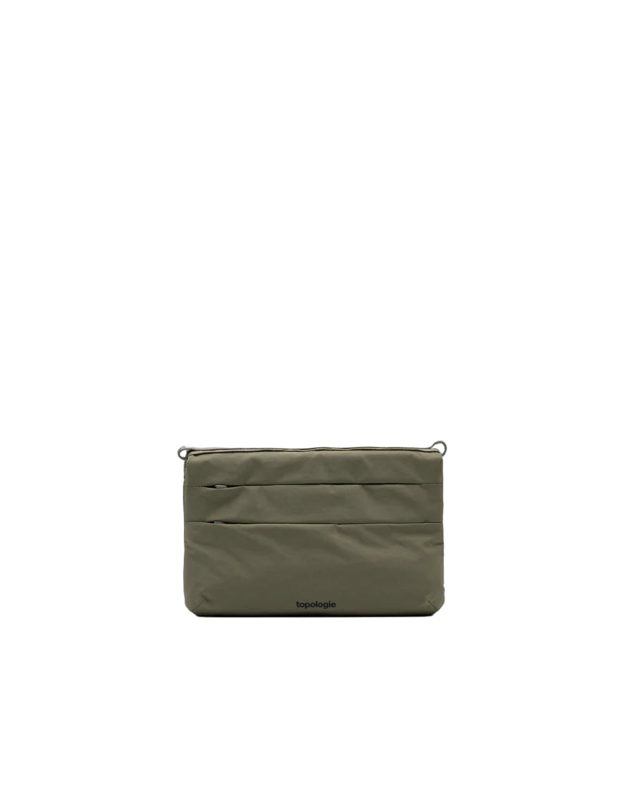 Green pouch with a brand logo on a light gray background