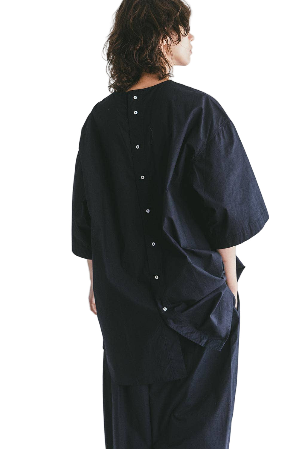 Oversized Navy Top by Mii Thaaii sister brand to Fog Linen Work on a person against a white background 