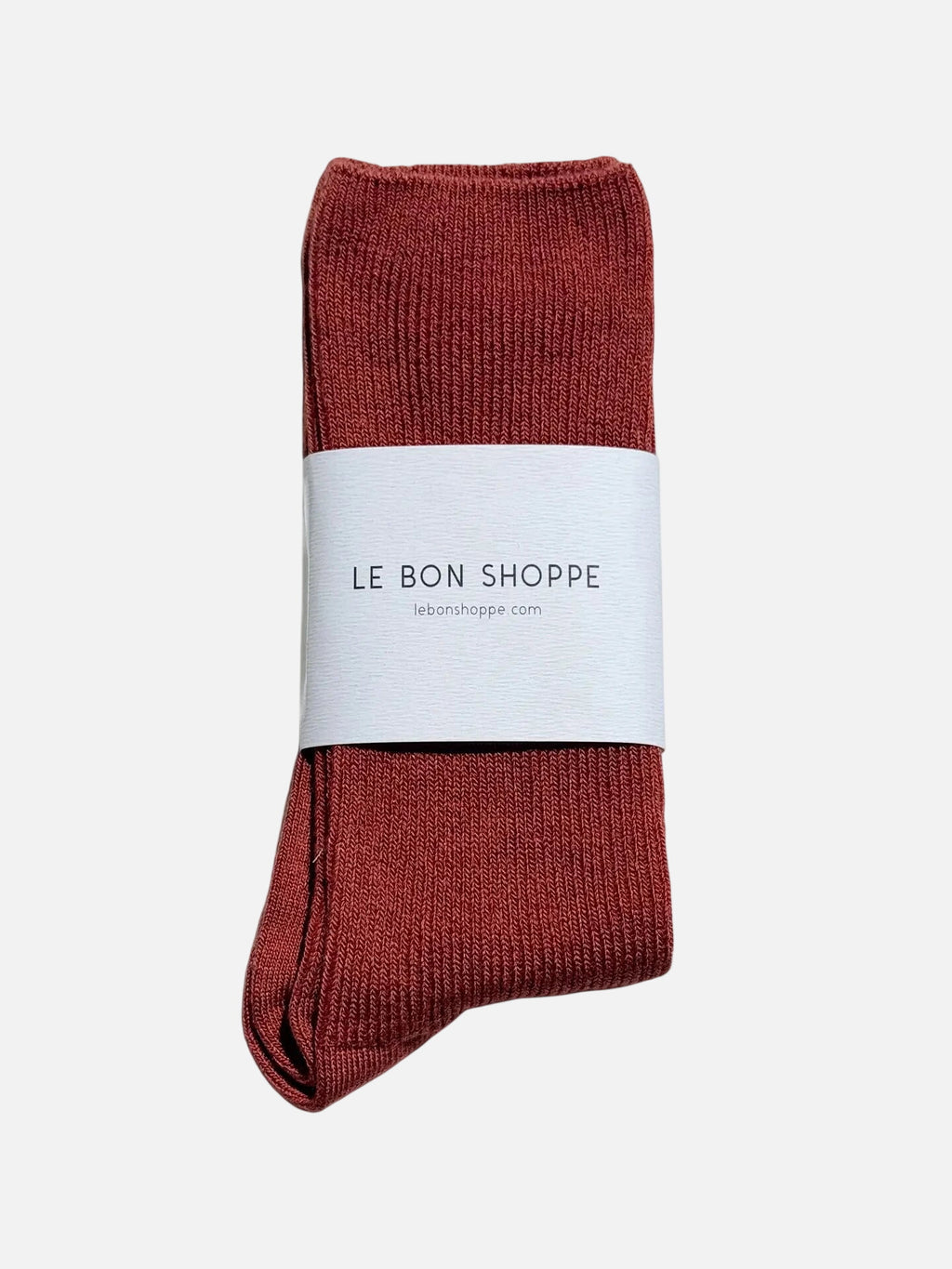 Red / Brown Le Bon Shoppe sock with a white label on a white  background