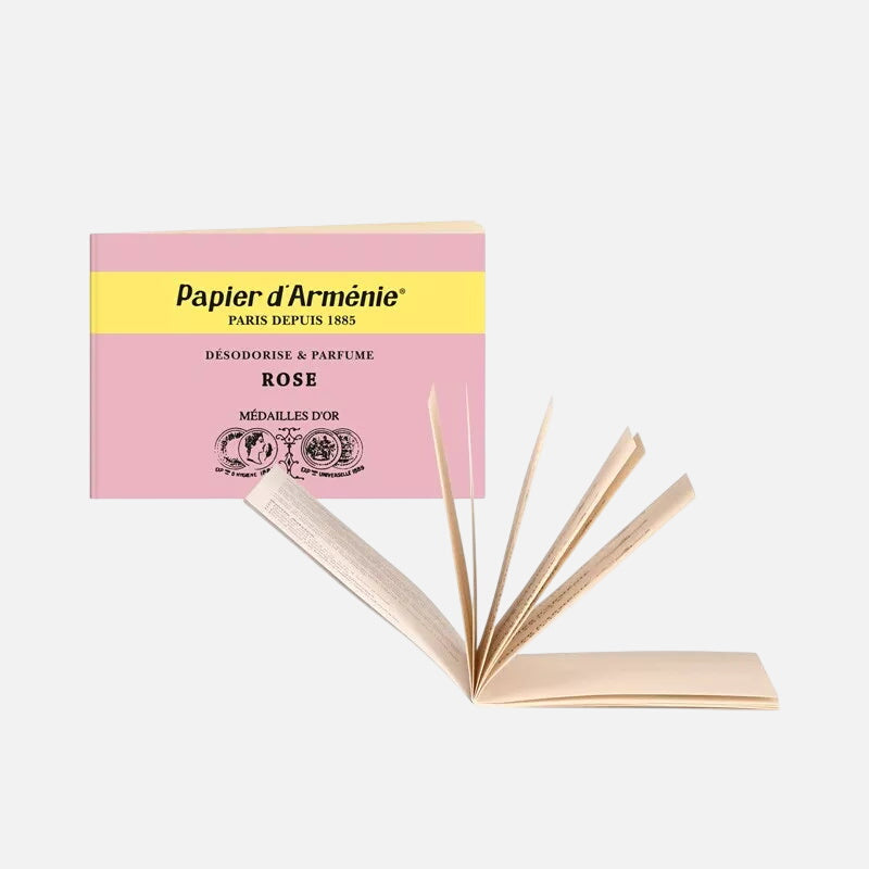 Open Pink Papier d'Arménie fragrance booklet on a white background 
