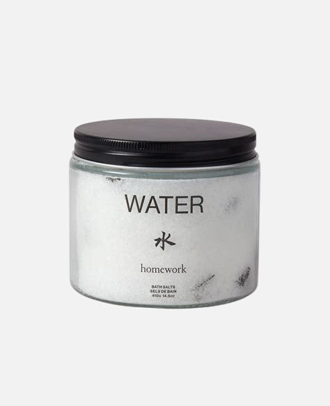 Jar labeled 'Water' with black lid on a white background