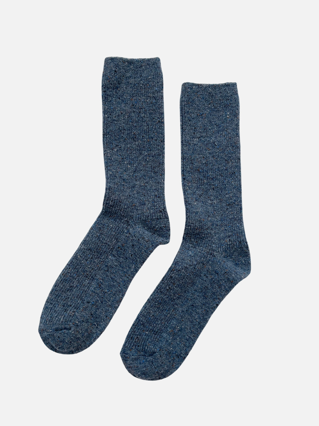 Pair of blue socks on a light gray background