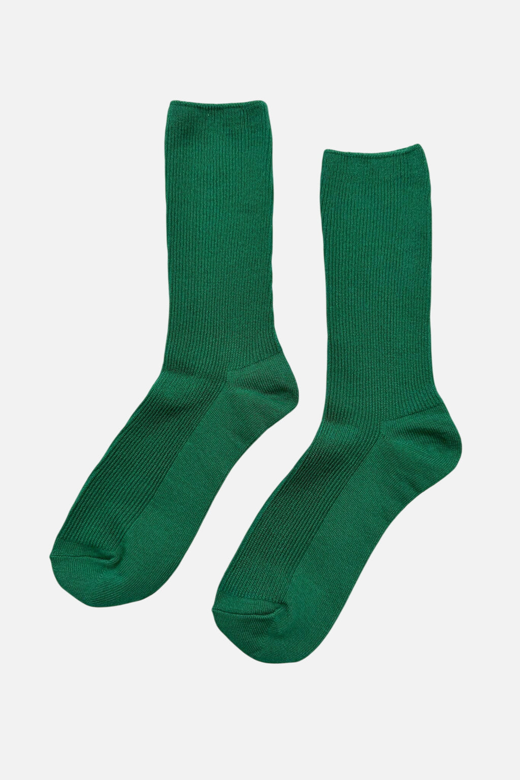 Pair of Le Bon Shoppe green socks on a white background
