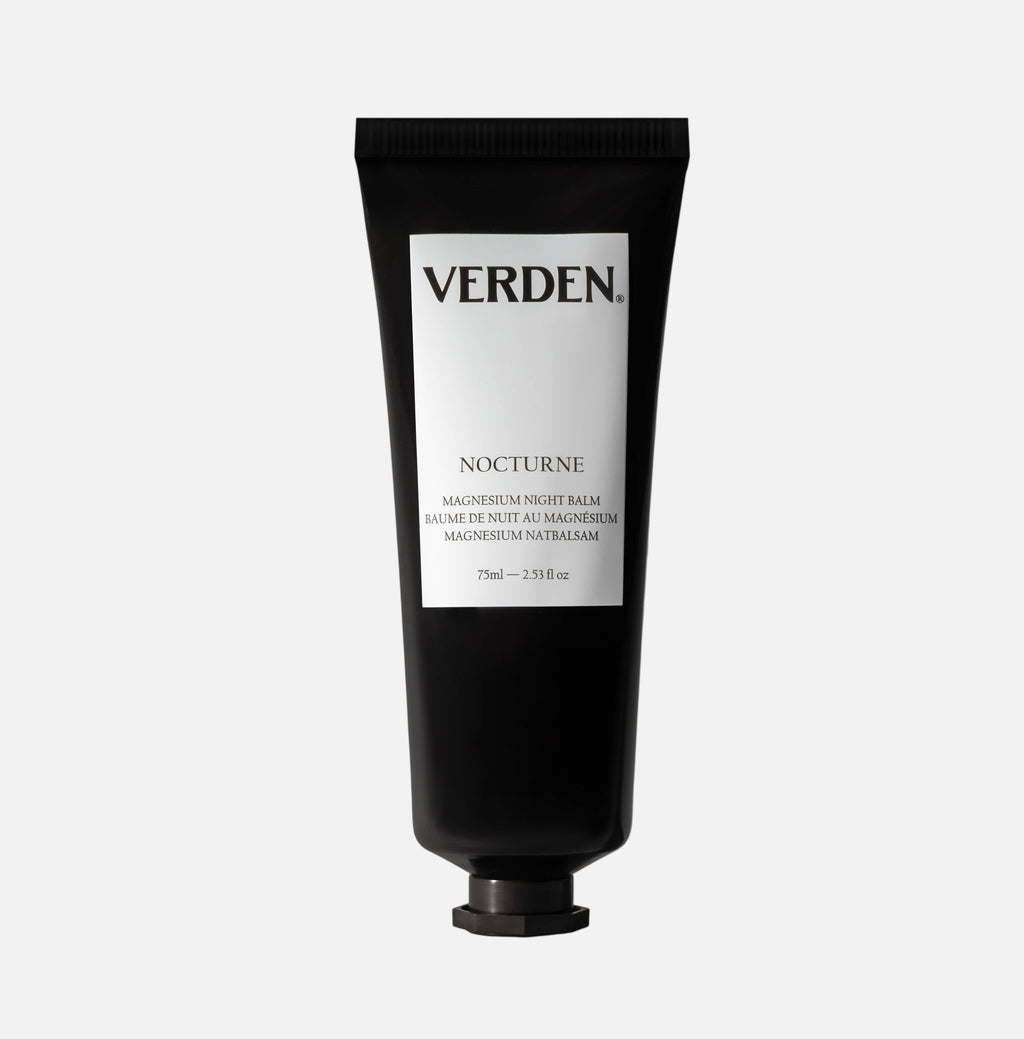 Black tube of Verden Nocturne balm on a white  background