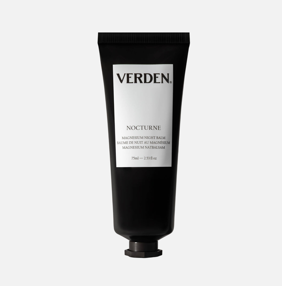 Black tube of Verden Nocturne balm on a white  background