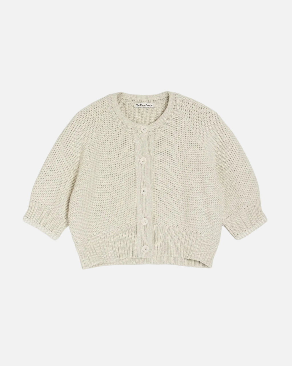 Light yellow knitted cardigan on a white background