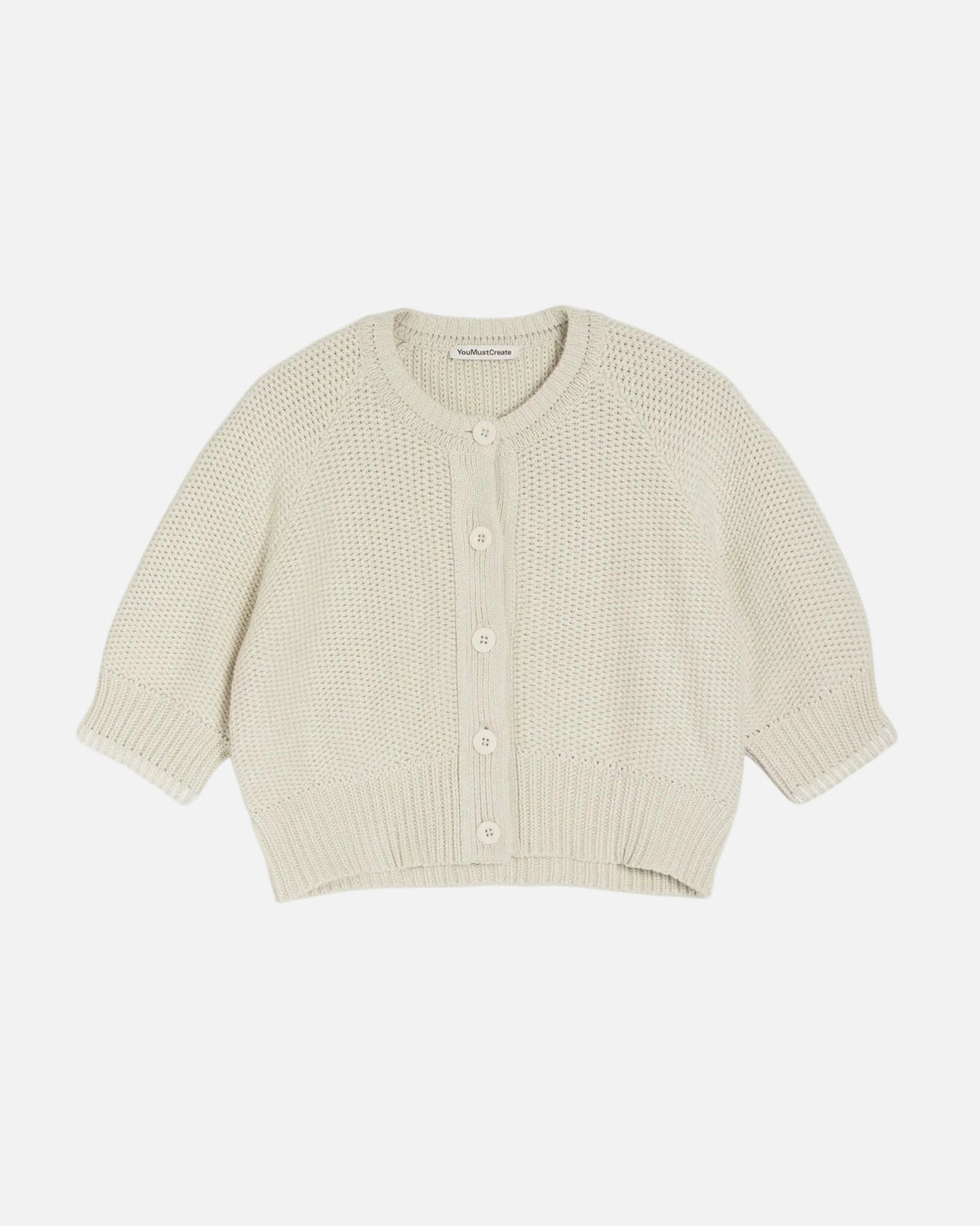 Light yellow knitted cardigan on a white background