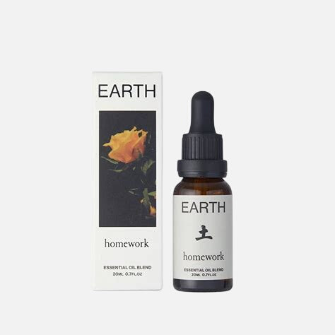 Earth homework essential oil blend bottle and packaging on a white background