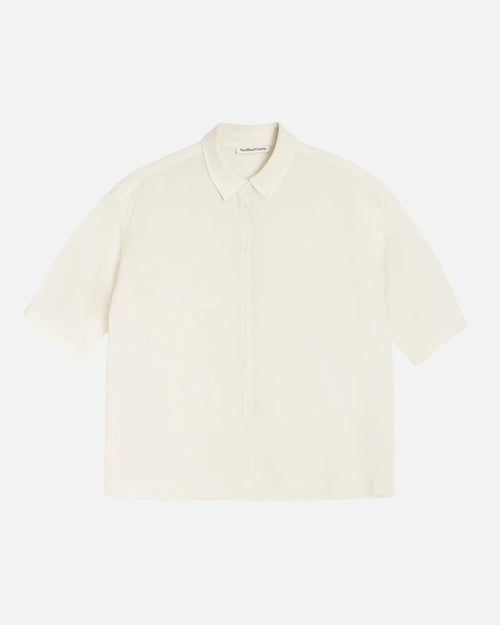 You Must Create light yellow short-sleeve shirt on a white background