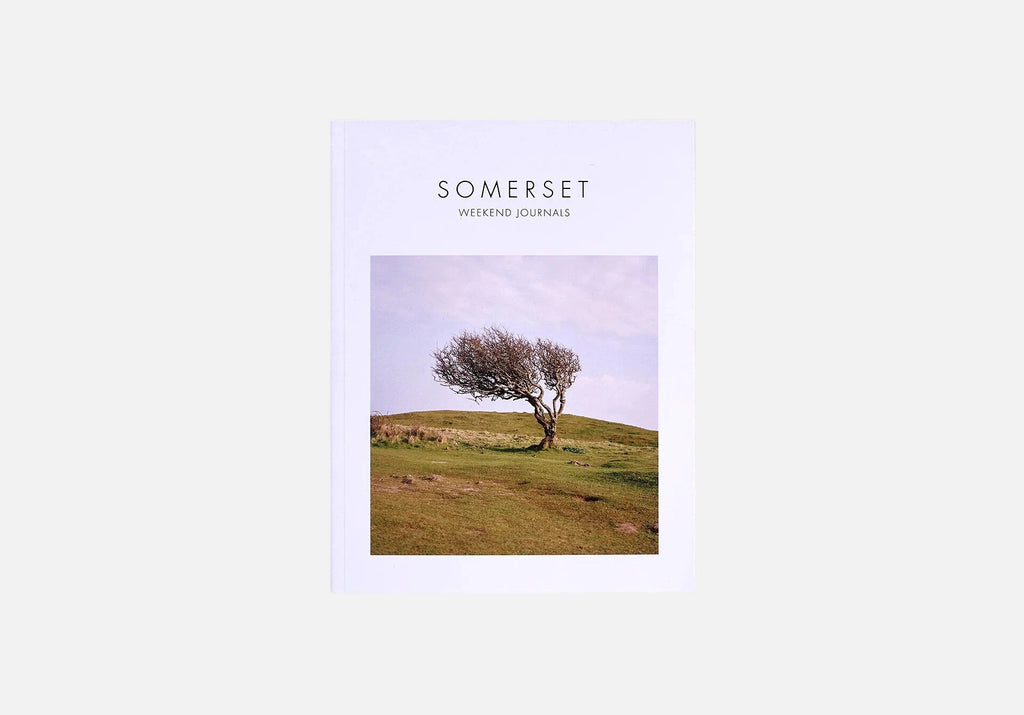 Weekend Journals Book titled 'Somerset' with a cover photo of a tree on a grassy hill, on a white background.