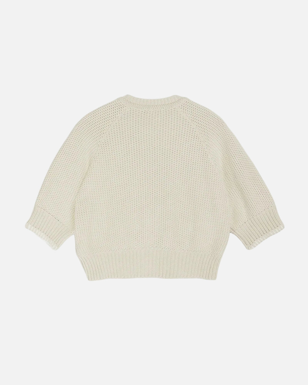 Light yellow knitted sweater on a white background