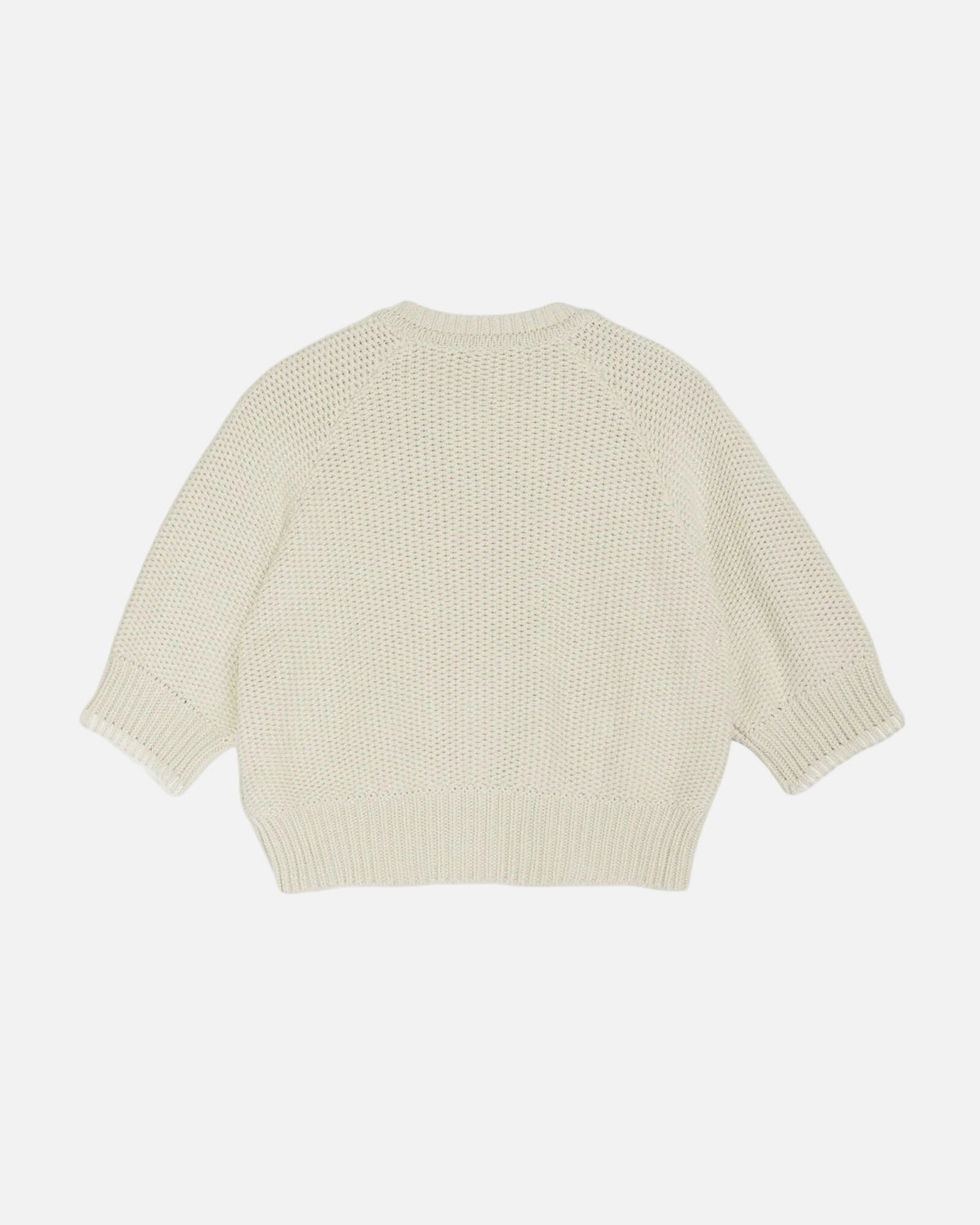 Light yellow knitted sweater on a white background